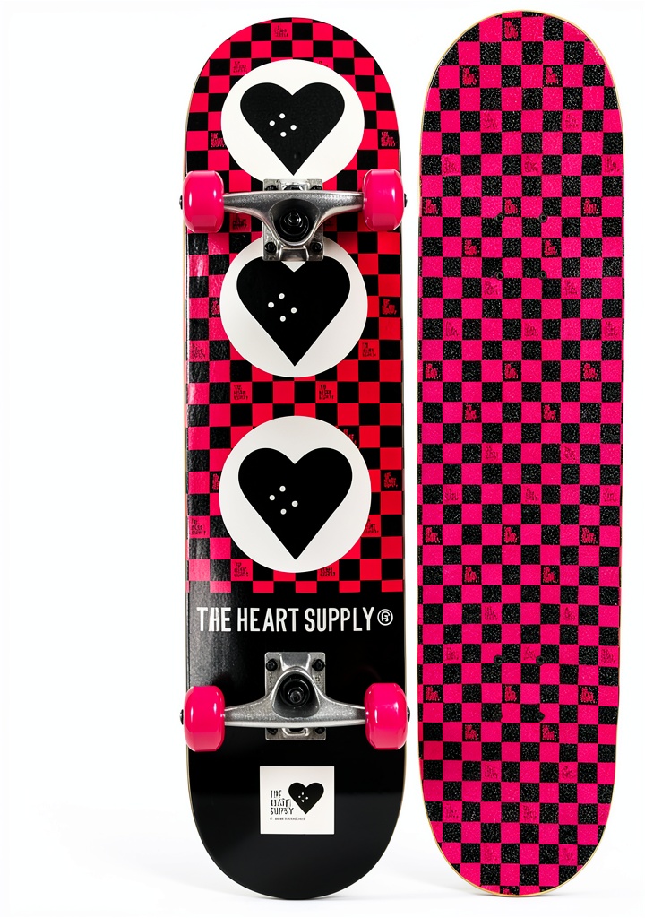 The Heart Supply Skateboard in Team Checkerboard design on a skate park ramp